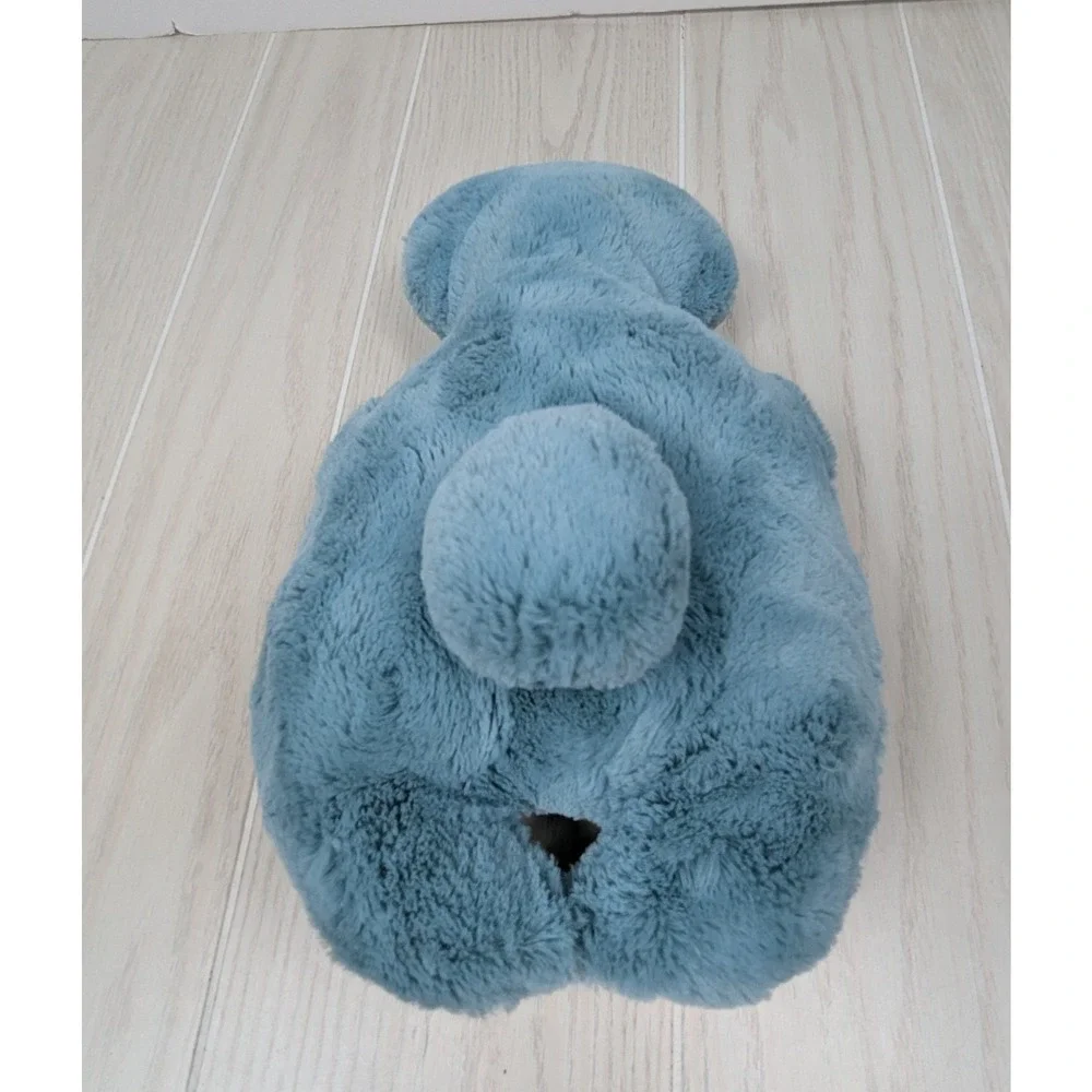 Mystery plush hugging arms Teal blue-green alien monster turtle Pom Bunny Tail